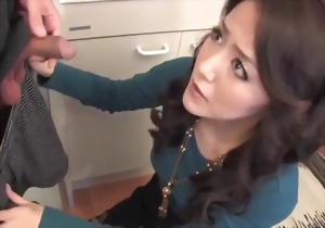 Asian angel with smoky eyes sucks a long dick on the knees