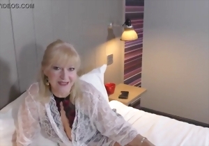 Good-looking mature in sexy lace lingerie shows her ass